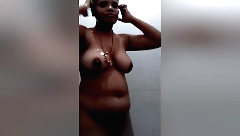 Indian milf has her big boobs on the floor in the shower