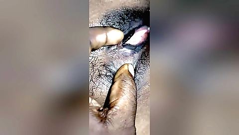 A hot girl with hairy pussy sucking on her boyfriend's dick