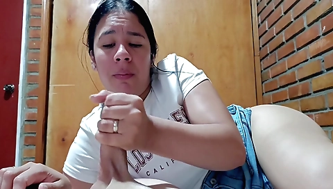 Indian girl is playing with her fingers in her black dress