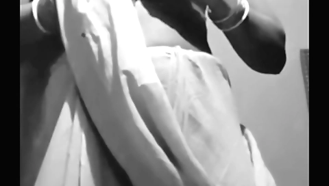 Girl in black shorts and red shirt is filming village bhabhi sarees