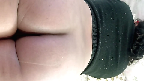 Big ass brunette with a nice body shows off her breasts