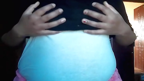 Brunette girl masturbating on her bed in a sexy solo scene