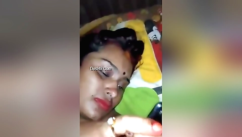 Indian brunette in a colorful outfit shows off her hairy body