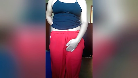 Indian brunette is licking her shaved pussy in bed