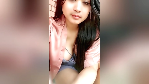 Horny brunette solo girl takes off clothes in the street