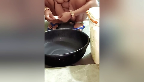 Indian babe gets wet on her back and fingers her pussy