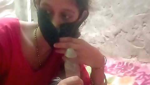 Indian chick in a sexy dress and a banana sucking a dildo