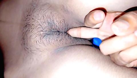 Indian amateur girl with hairy pussy fucks on the bed